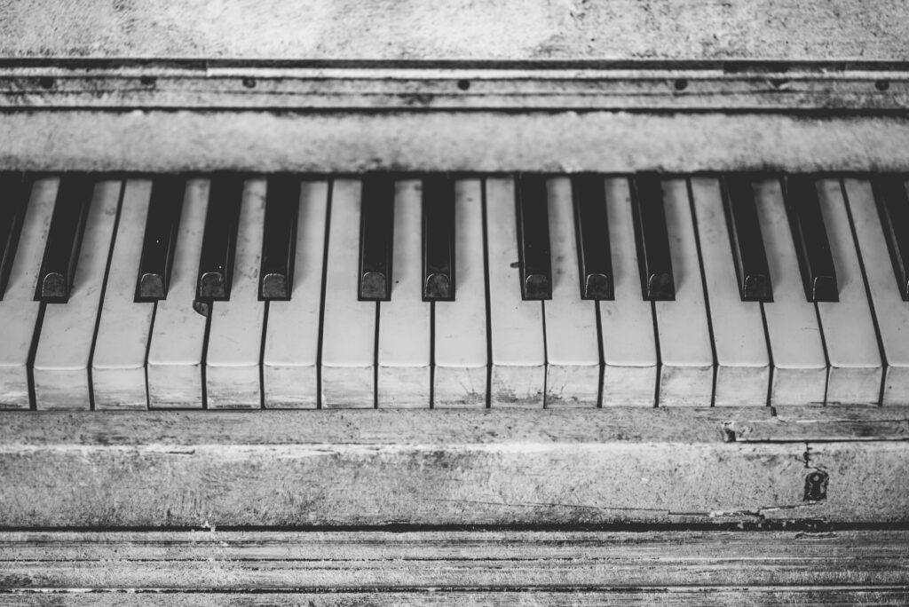 Black and white close-up of vintage piano keys, showcasing musical nostalgia.